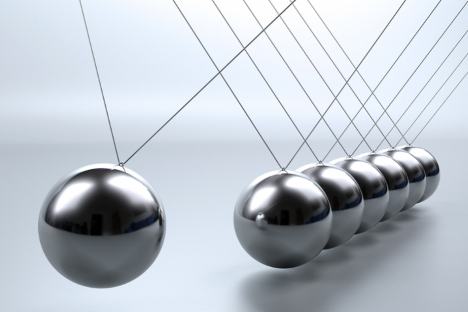 Image of a Newton's cradle in motion.