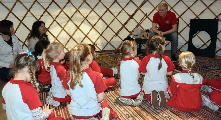 A group of Brownies inside the story telling tent at NEC.