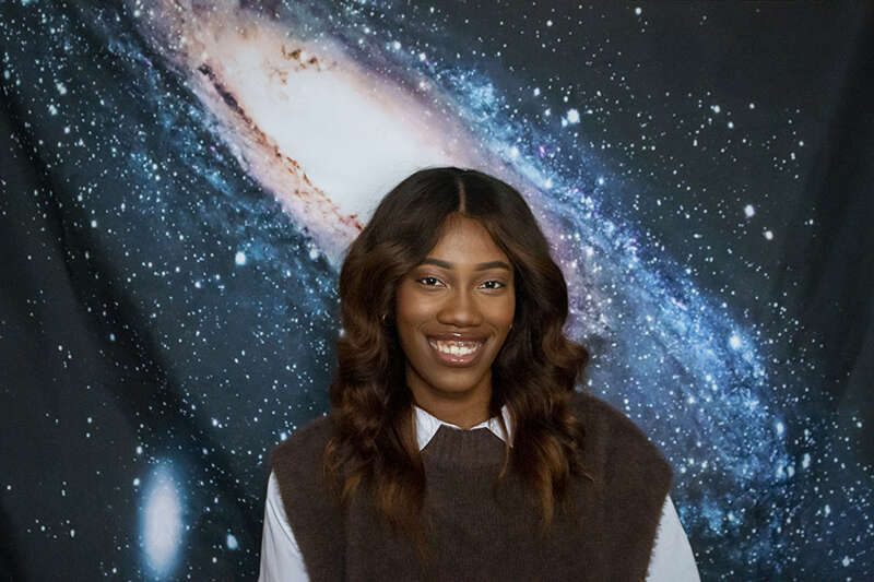 Vanessa Okafor in front of a galaxy image