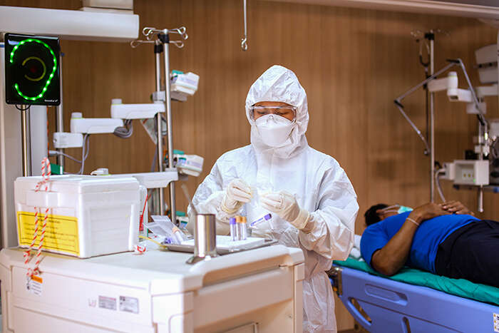 A medical worker wearing a hazmat suit to protect against Ebola