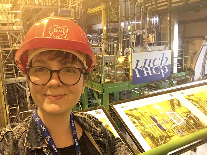 Physicist Abbie Chadwick at CERN wearing a hard hat