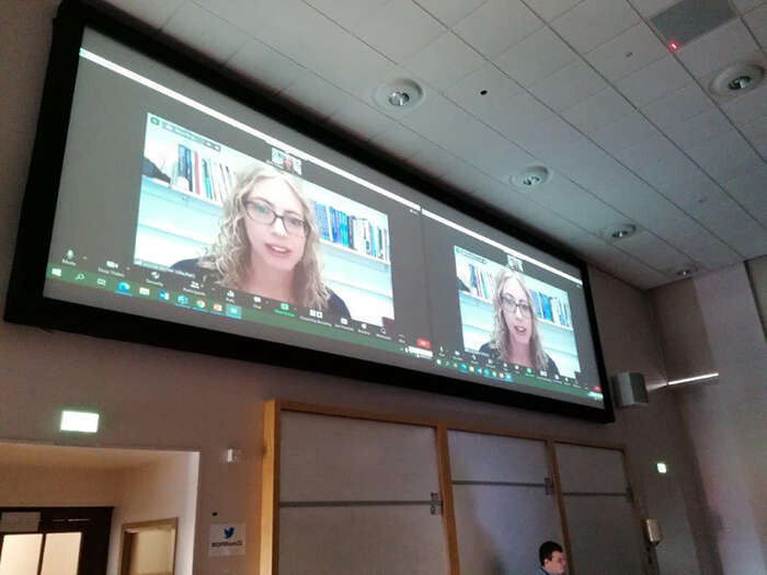 Prof Louise Archer speaking via a big screen