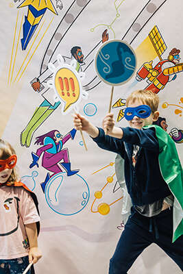 Children in costume at IOP Superheroes Unlimited exhibition at Caledonian Road