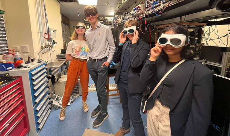 Students wearing safety goggles for a cold-atoms lab tour at Nottingham University