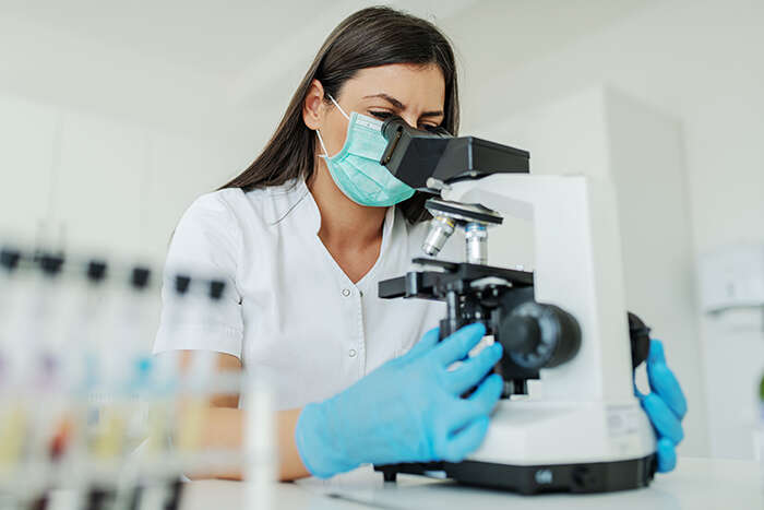 A female scientist in a laboratory researching a contagious disease