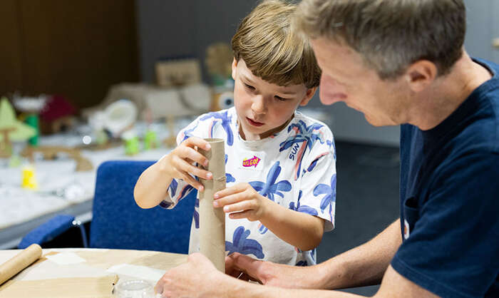 A man and boy making a model at Mimi’s Rainbow Adventure family day August 2023